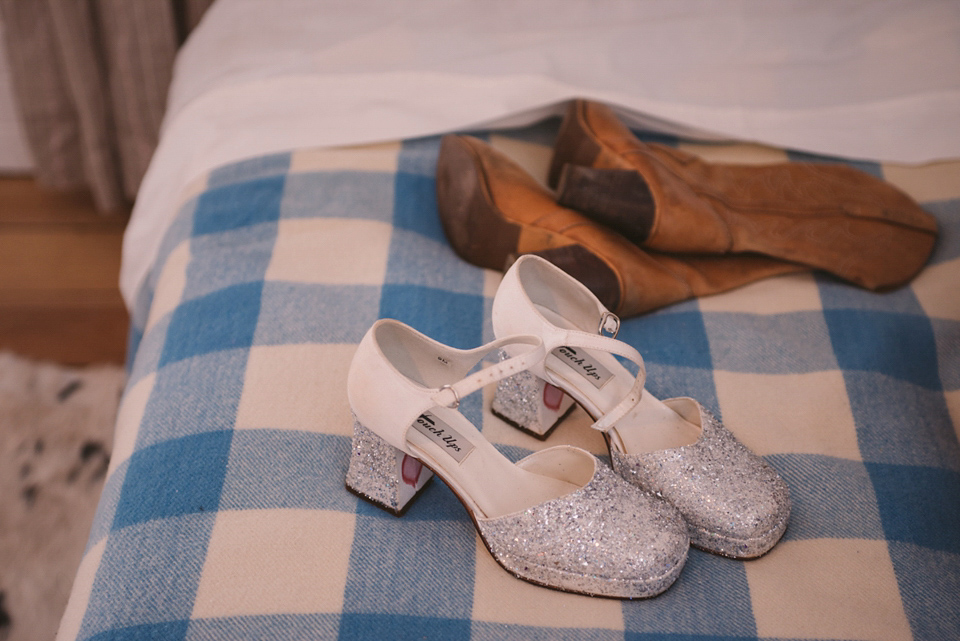 A blue sequin wedding dress for a colourful and flower filled picnic wedding. Photography by Sarah Burton.