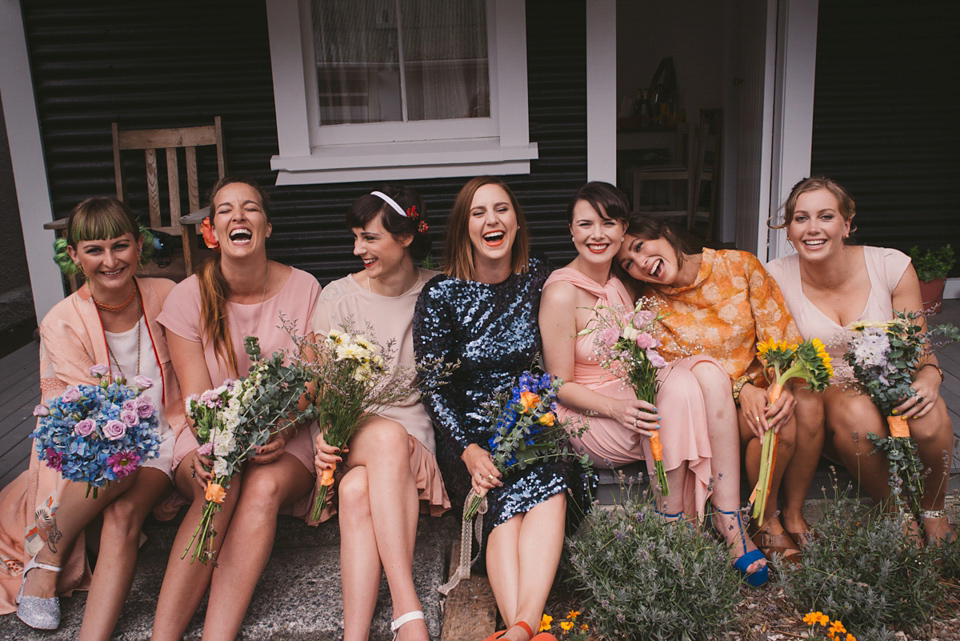 A blue sequin wedding dress for a colourful and flower filled picnic wedding. Photography by Sarah Burton.