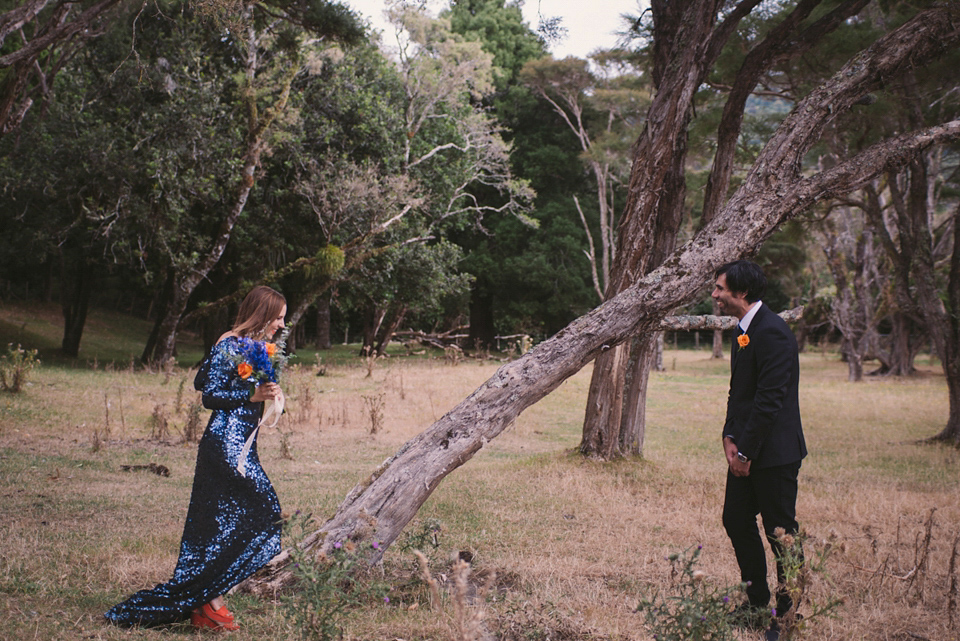 A blue sequin wedding dress for a colourful and flower filled picnic wedding. Photography by Sarah Burton.