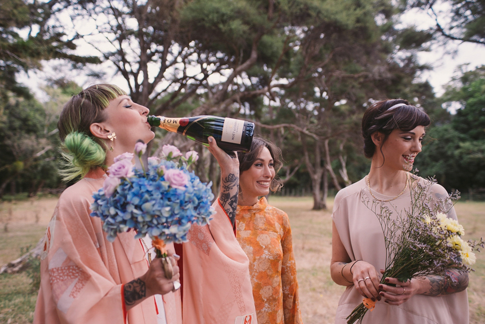 A blue sequin wedding dress for a colourful and flower filled picnic wedding. Photography by Sarah Burton.