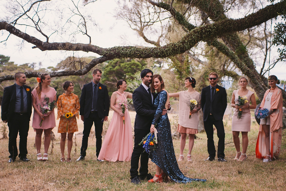 A blue sequin wedding dress for a colourful and flower filled picnic wedding. Photography by Sarah Burton.