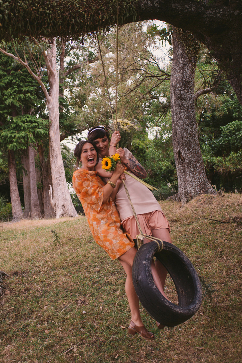 A blue sequin wedding dress for a colourful and flower filled picnic wedding. Photography by Sarah Burton.