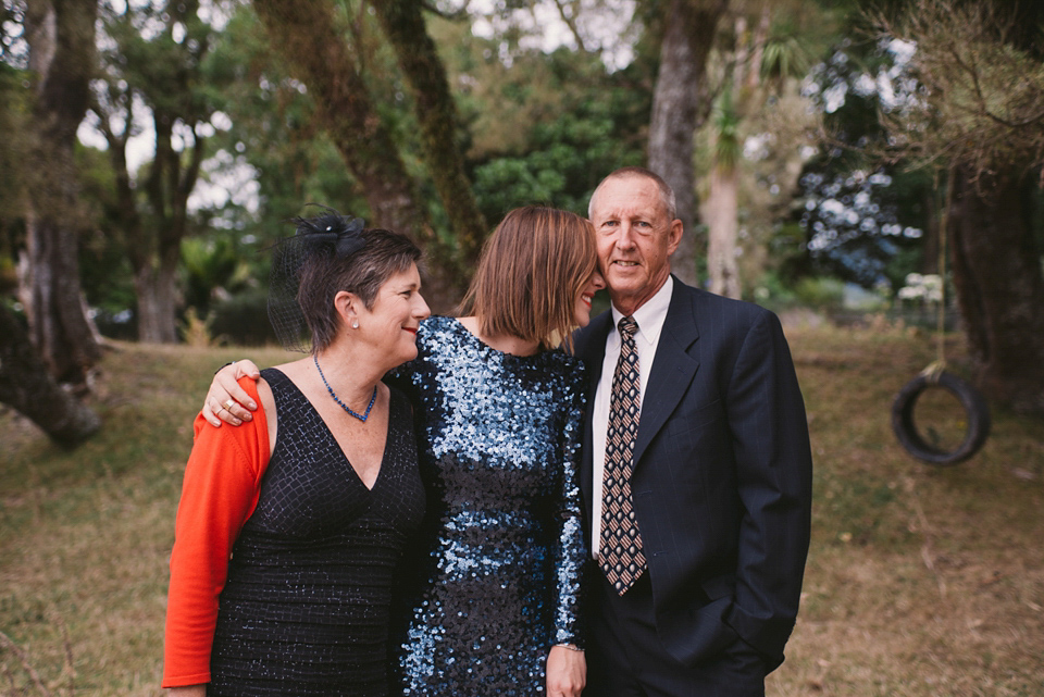 A blue sequin wedding dress for a colourful and flower filled picnic wedding. Photography by Sarah Burton.