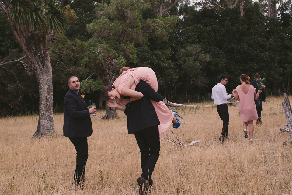 A blue sequin wedding dress for a colourful and flower filled picnic wedding. Photography by Sarah Burton.