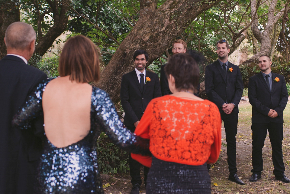 A blue sequin wedding dress for a colourful and flower filled picnic wedding. Photography by Sarah Burton.