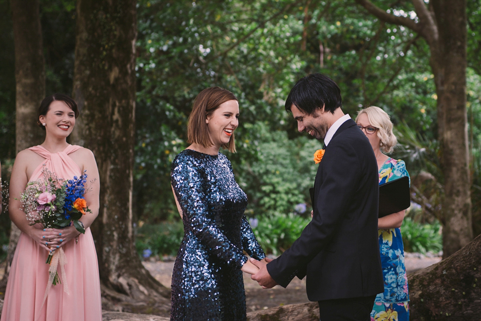 A blue sequin wedding dress for a colourful and flower filled picnic wedding. Photography by Sarah Burton.