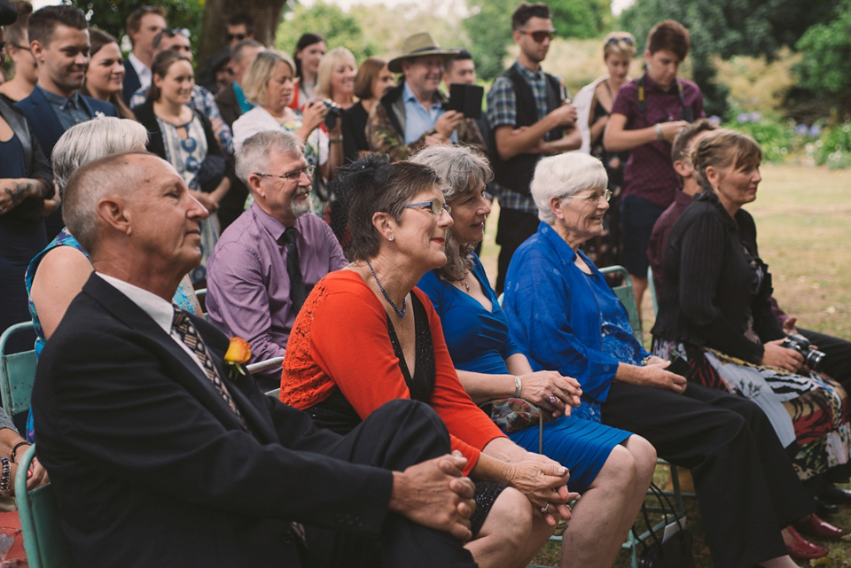 A blue sequin wedding dress for a colourful and flower filled picnic wedding. Photography by Sarah Burton.