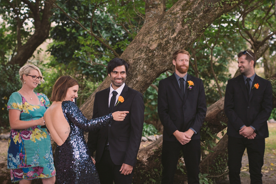 A blue sequin wedding dress for a colourful and flower filled picnic wedding. Photography by Sarah Burton.