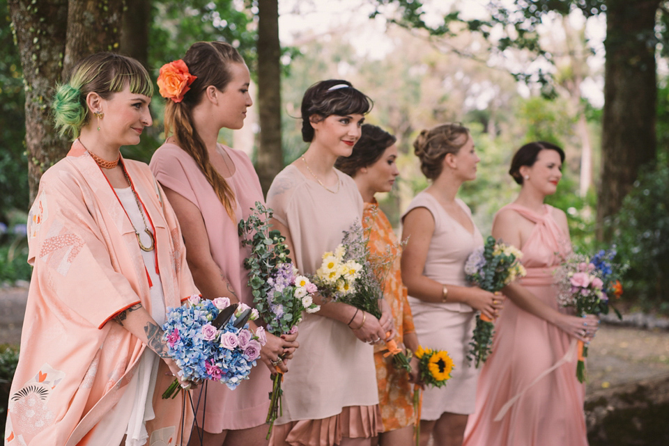 A blue sequin wedding dress for a colourful and flower filled picnic wedding. Photography by Sarah Burton.