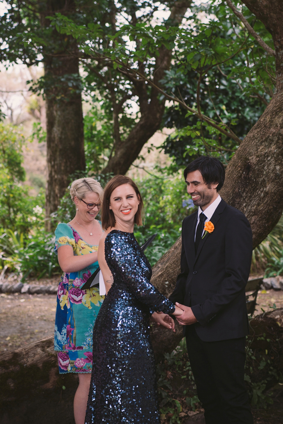 A blue sequin wedding dress for a colourful and flower filled picnic wedding. Photography by Sarah Burton.