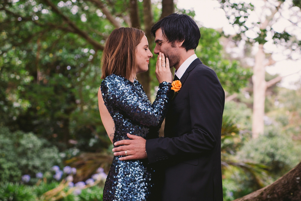 A blue sequin wedding dress for a colourful and flower filled picnic wedding. Photography by Sarah Burton.