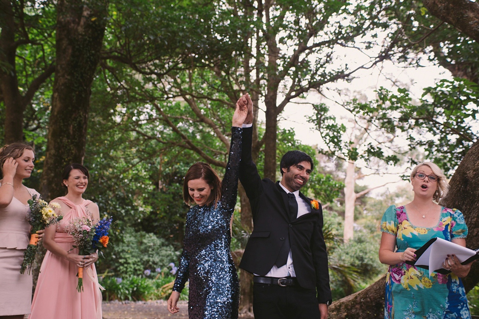 A blue sequin wedding dress for a colourful and flower filled picnic wedding. Photography by Sarah Burton.