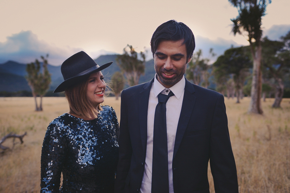 A blue sequin wedding dress for a colourful and flower filled picnic wedding. Photography by Sarah Burton.