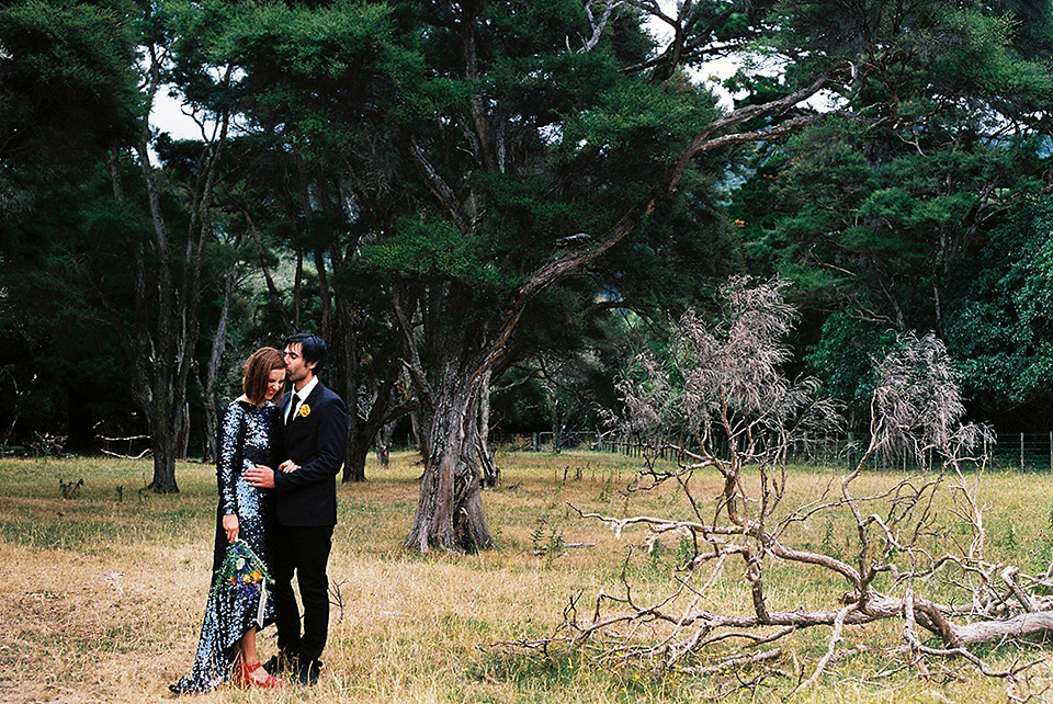 A blue sequin wedding dress for a colourful and flower filled picnic wedding. Photography by Sarah Burton.