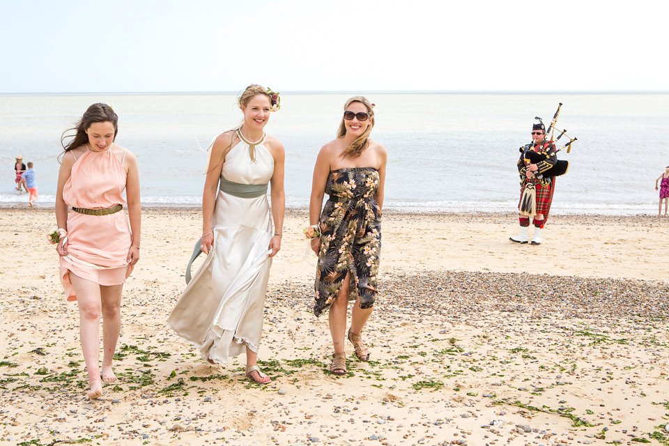 A halterneck dress for a boho bride yoga teacher and her seaside wedding. Photography by Beth Moseley.
