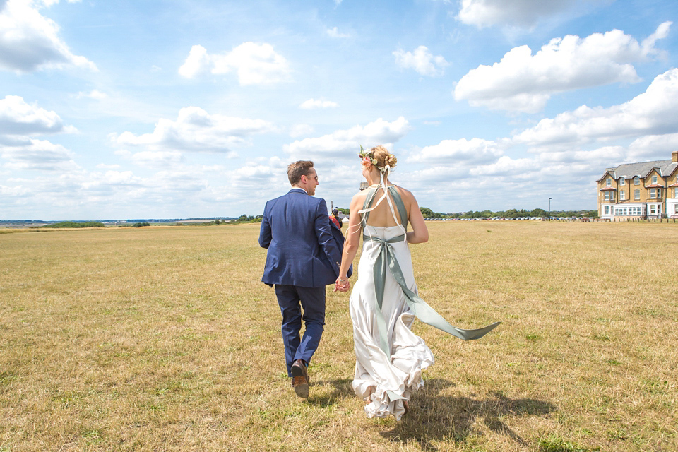 A halterneck dress for a boho bride yoga teacher and her seaside wedding. Photography by Beth Moseley. A halterneck dress for a boho bride yoga teacher and her seaside wedding. Photography by Beth Moseley.