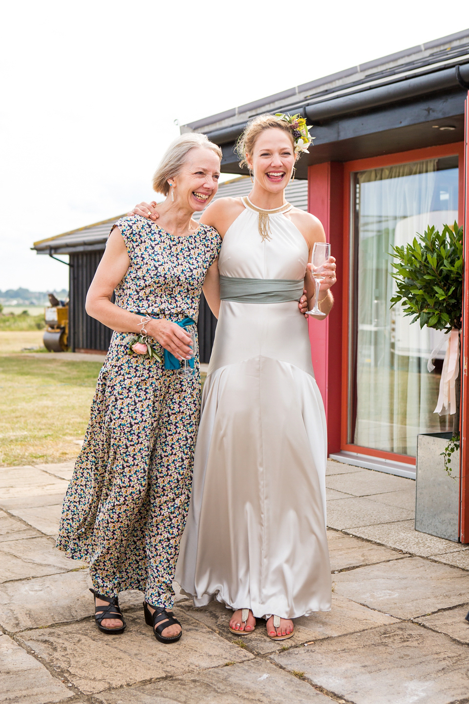 A halterneck dress for a boho bride yoga teacher and her seaside wedding. Photography by Beth Moseley.