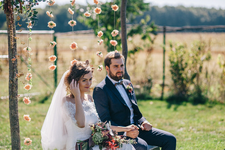 Laura wore a gown by Otilia Brailoiu for her Autumn wedding in the Romanian countryside. Images by Green Antlers Photography.