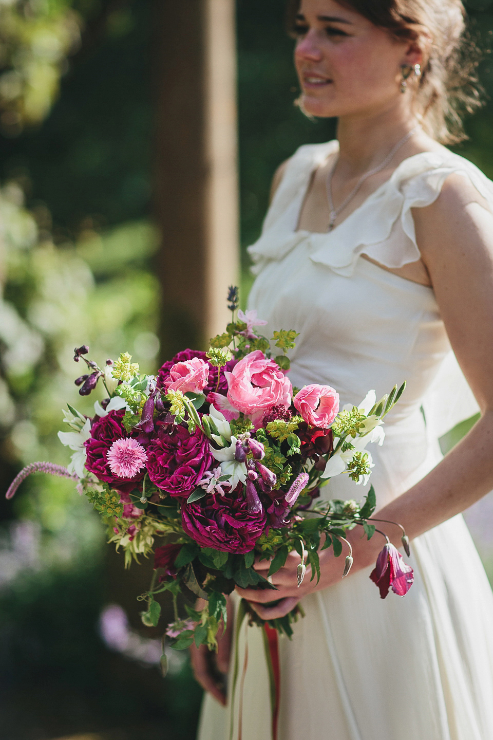 English country garden wedding elegance at Mapperton Gardens. Gowns by Belle & Bunty and floral styling by the wonderful Charlie Ryrlie of The Real Cut Flower Garden. Photography by Helen Lisk.