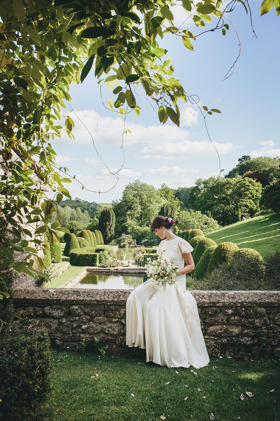 English country garden wedding elegance at Mapperton Gardens. Gowns by Belle & Bunty and floral styling by the wonderful Charlie Ryrlie of The Real Cut Flower Garden. Photography by Helen Lisk.