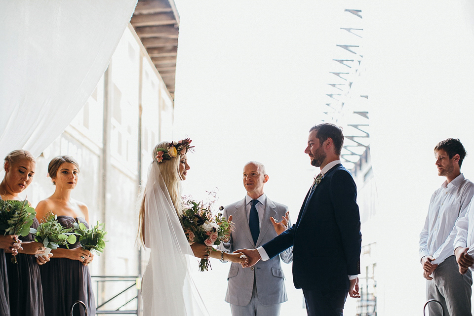 A laid back and romantic disused factory wedding in Brooklyn New York. Bride Maris wore a Nicole Miller gown via BHLDN. Photoggraphy by Jean-Laurent Gaudy.