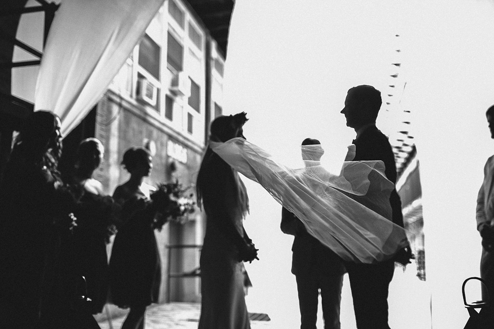 A laid back and romantic disused factory wedding in Brooklyn New York. Bride Maris wore a Nicole Miller gown via BHLDN. Photoggraphy by Jean-Laurent Gaudy.