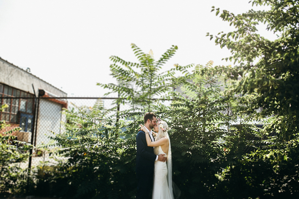 A laid back and romantic disused factory wedding in Brooklyn New York. Bride Maris wore a Nicole Miller gown via BHLDN. Photoggraphy by Jean-Laurent Gaudy.