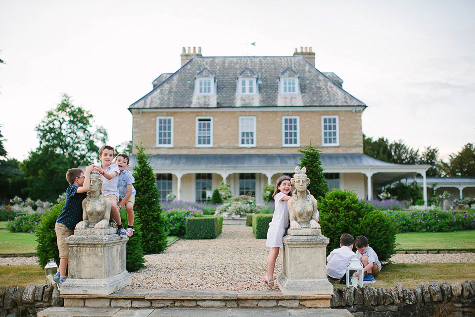 Bride Sarah wears a dropped waist gown by Stephanie Allin for her English country garden wedding. Photography by Joanna Brown.