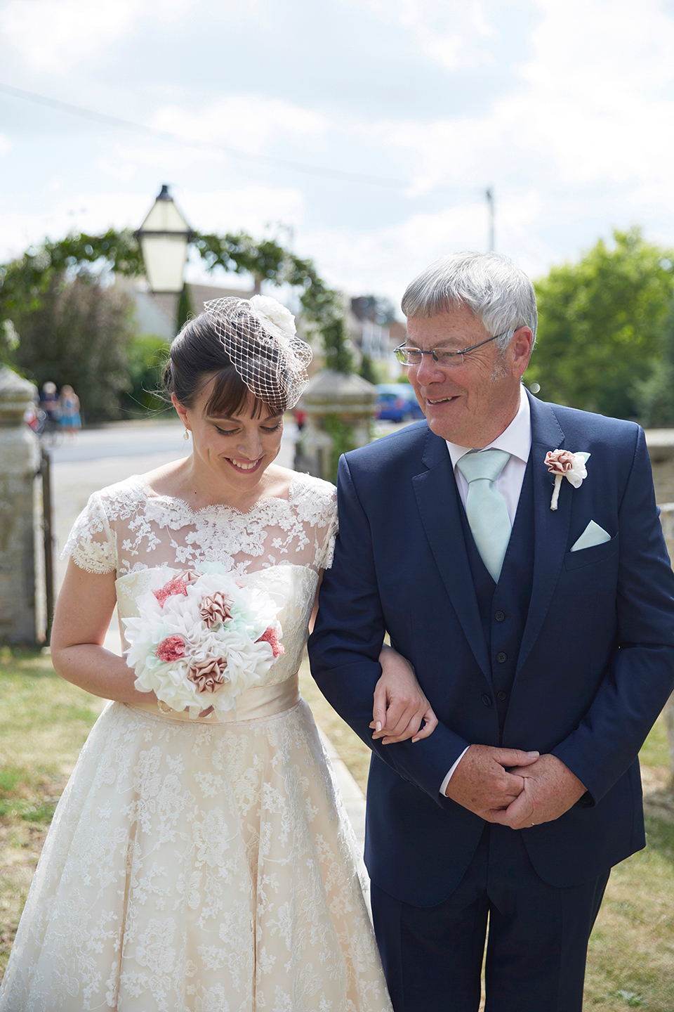 A Short Lace Dress and Fabric Flowers for a Wedding in the Cambridgeshire Countryside. Photography by Natalie J. Weddings Photography.