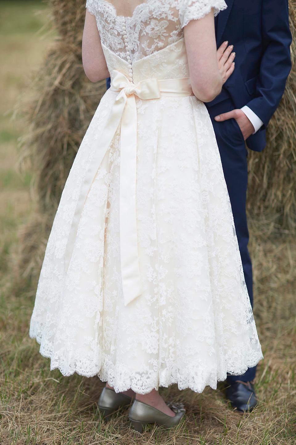 A Short Lace Dress and Fabric Flowers for a Wedding in the Cambridgeshire Countryside. Photography by Natalie J. Weddings Photography.