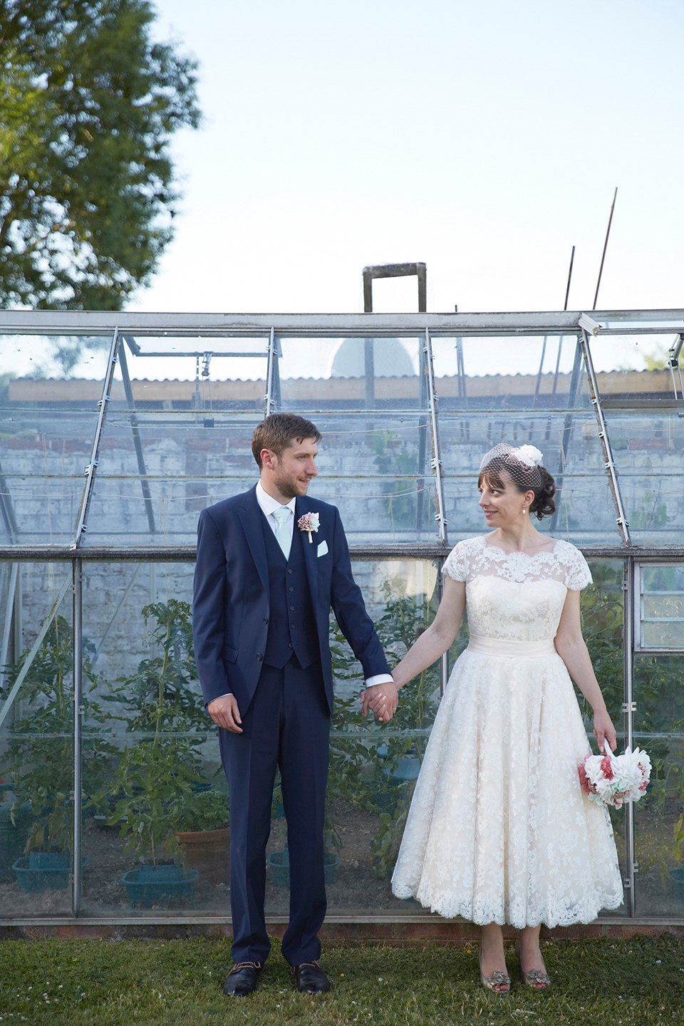 A Short Lace Dress and Fabric Flowers for a Wedding in the Cambridgeshire Countryside. Photography by Natalie J. Weddings Photography.