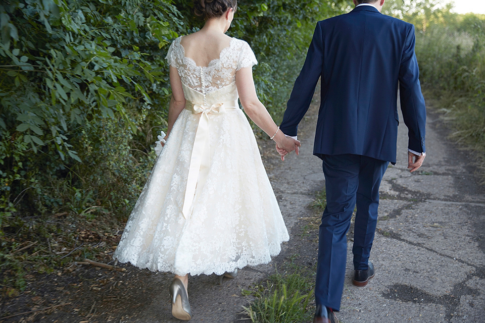 A Short Lace Dress and Fabric Flowers for a Wedding in the Cambridgeshire Countryside. Photography by Natalie J. Weddings Photography.