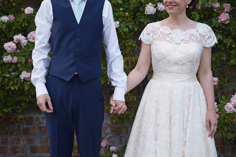 A Short Lace Dress and Fabric Flowers for a Wedding in the Cambridgeshire Countryside. Photography by Natalie J. Weddings Photography.