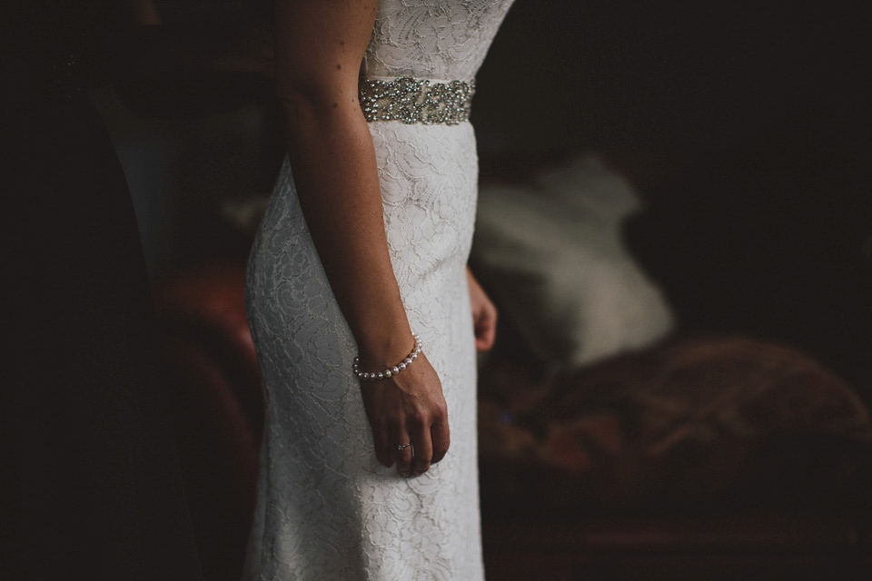 Bride Jenni wears a Watters gown for her wedding at Ellingham Hall in Northumberland. Photography by Awake and Dreaming Weddings.
