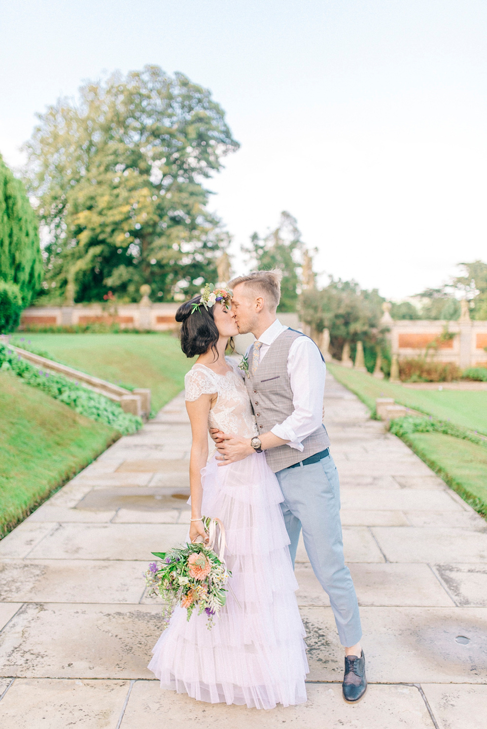Bride Laura wore a tiered wedding dress by Katya Katya Shehurina for her peach wedding at Lartington Hall in Teesdale. Photography by Sarah Jane Ethan.