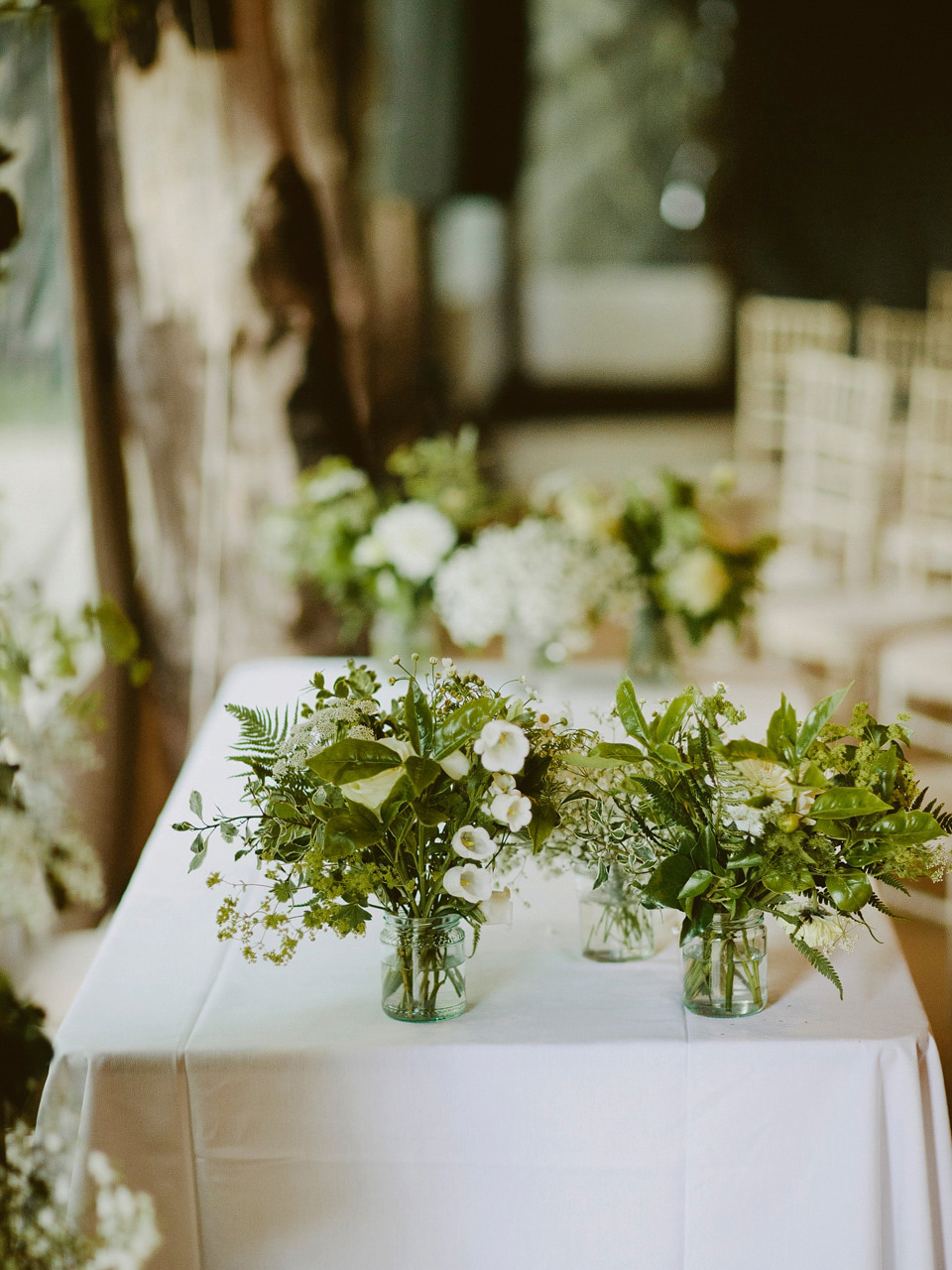 David Fielden elegance for a green and white country garden wedding at Dewsall Court. Fine art film photography by David Jenkins.