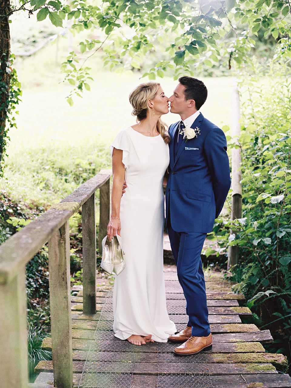 David Fielden elegance for a green and white country garden wedding at Dewsall Court. Fine art film photography by David Jenkins.