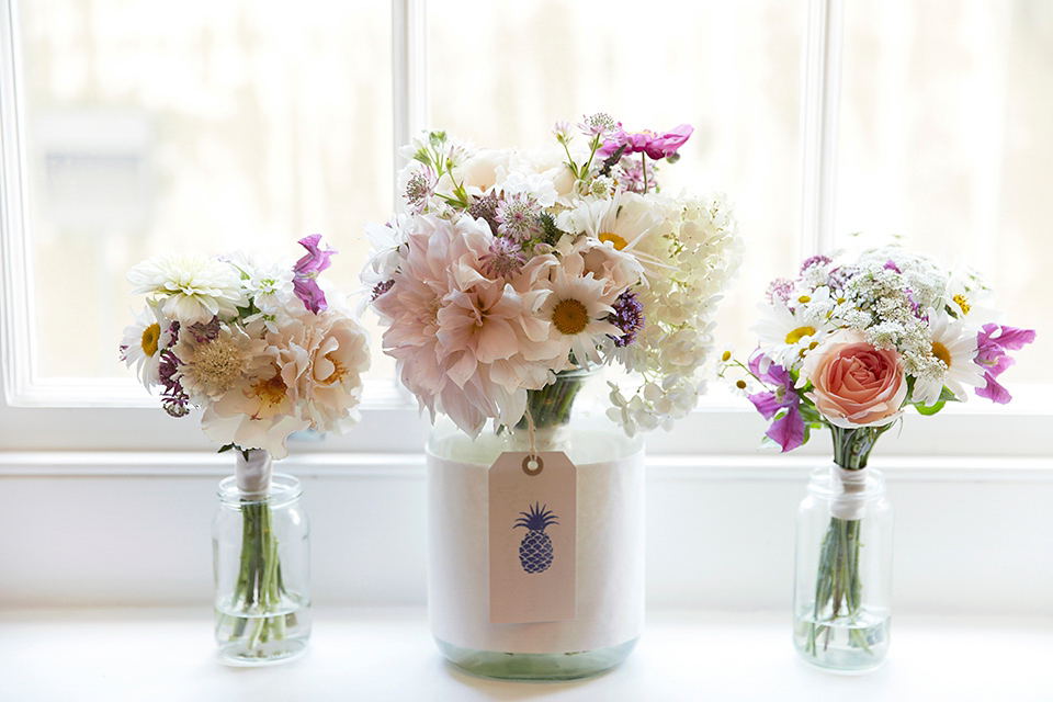 A 50's inspired tea-length dress for a pastel colour London pub wedding. Photography by Natalie J. Weddings.