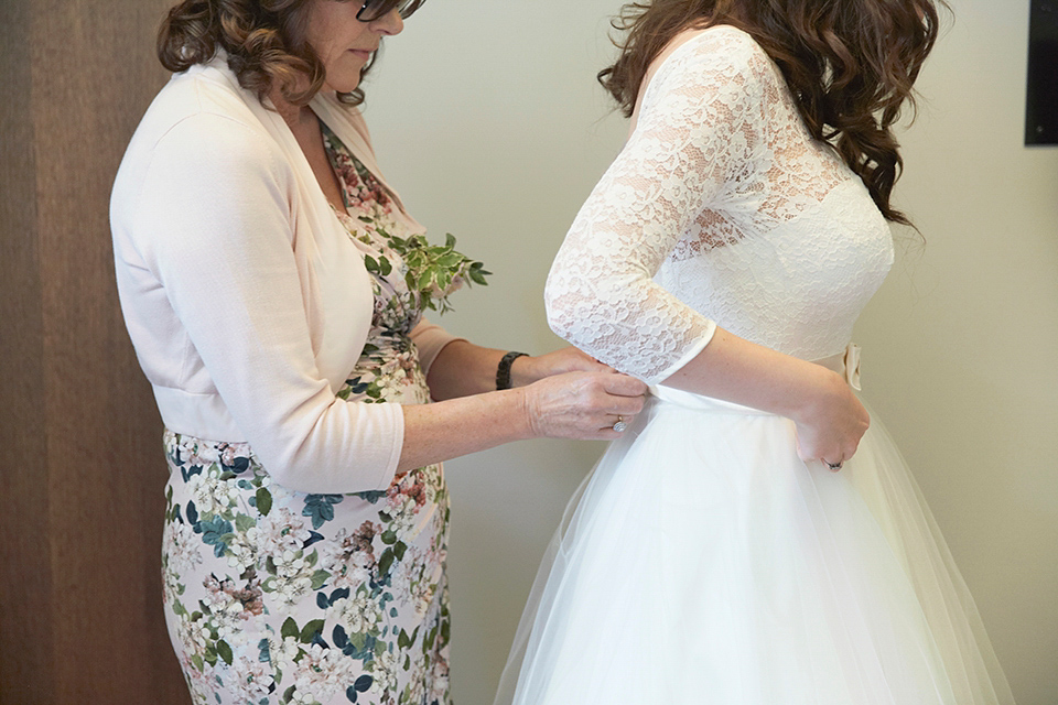 A 50's inspired tea-length dress for a pastel colour London pub wedding. Photography by Natalie J. Weddings.