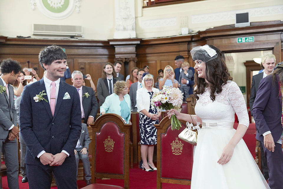 A 50's inspired tea-length dress for a pastel colour London pub wedding. Photography by Natalie J. Weddings.