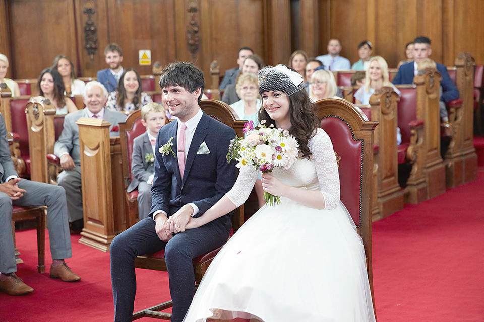 A 50's inspired tea-length dress for a pastel colour London pub wedding. Photography by Natalie J. Weddings.