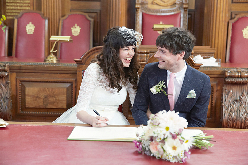 A 50's inspired tea-length dress for a pastel colour London pub wedding. Photography by Natalie J. Weddings.