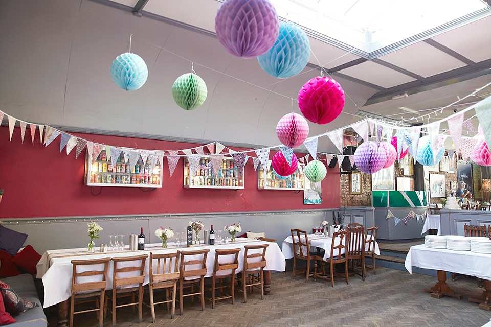 A 50's inspired tea-length dress for a pastel colour London pub wedding. Photography by Natalie J. Weddings.