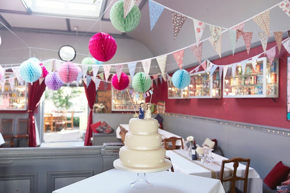 A 50's inspired tea-length dress for a pastel colour London pub wedding. Photography by Natalie J. Weddings.