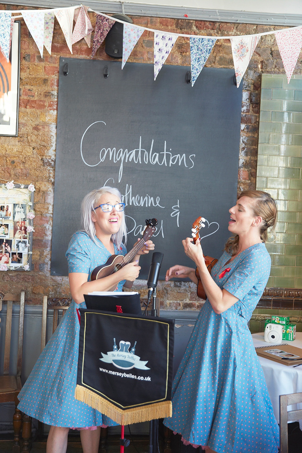 A 50's inspired tea-length dress for a pastel colour London pub wedding. Photography by Natalie J. Weddings.