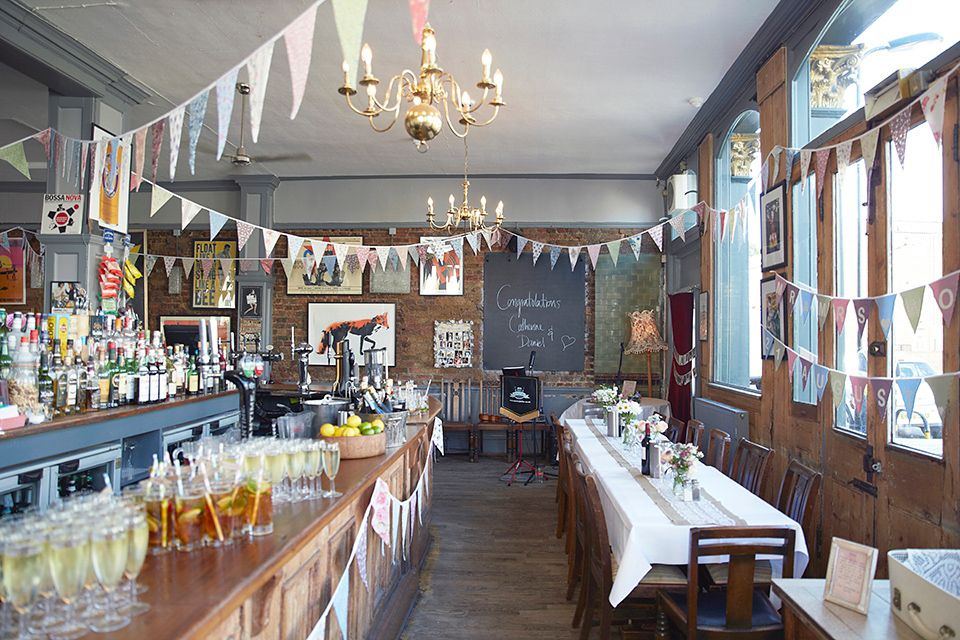 A 50's inspired tea-length dress for a pastel colour London pub wedding. Photography by Natalie J. Weddings.