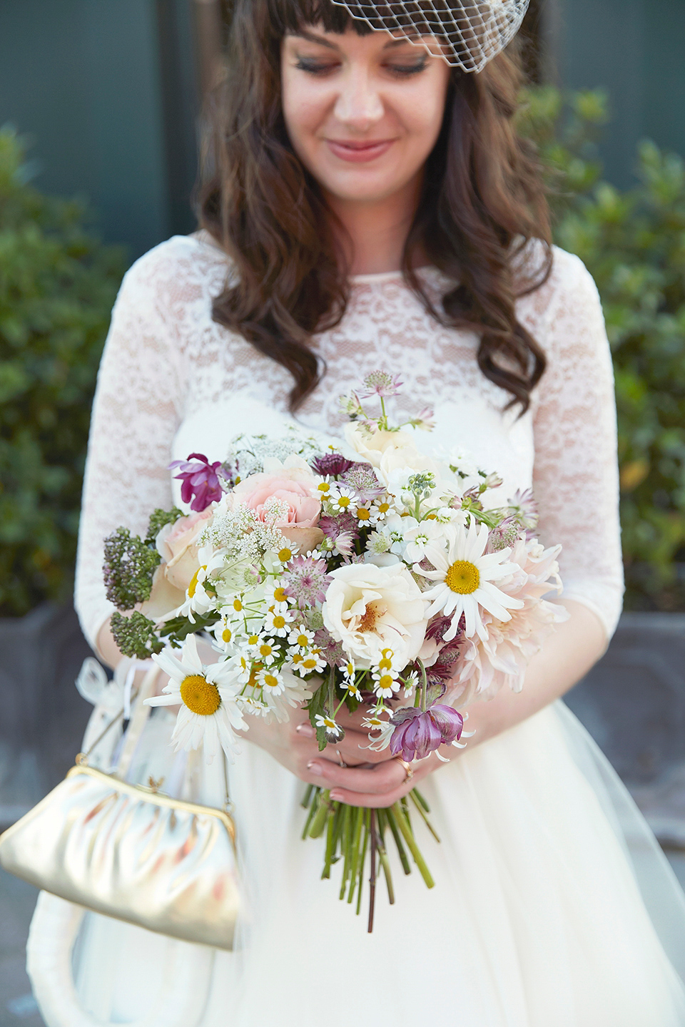 A 50's inspired tea-length dress for a pastel colour London pub wedding. Photography by Natalie J. Weddings.