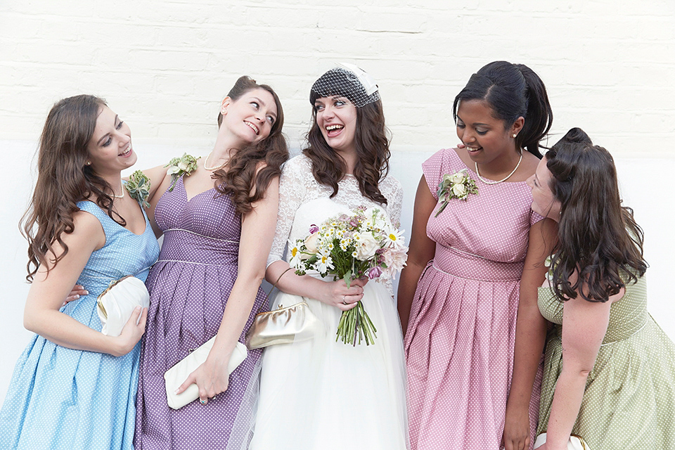 A 50's inspired tea-length dress for a pastel colour London pub wedding. Photography by Natalie J. Weddings.