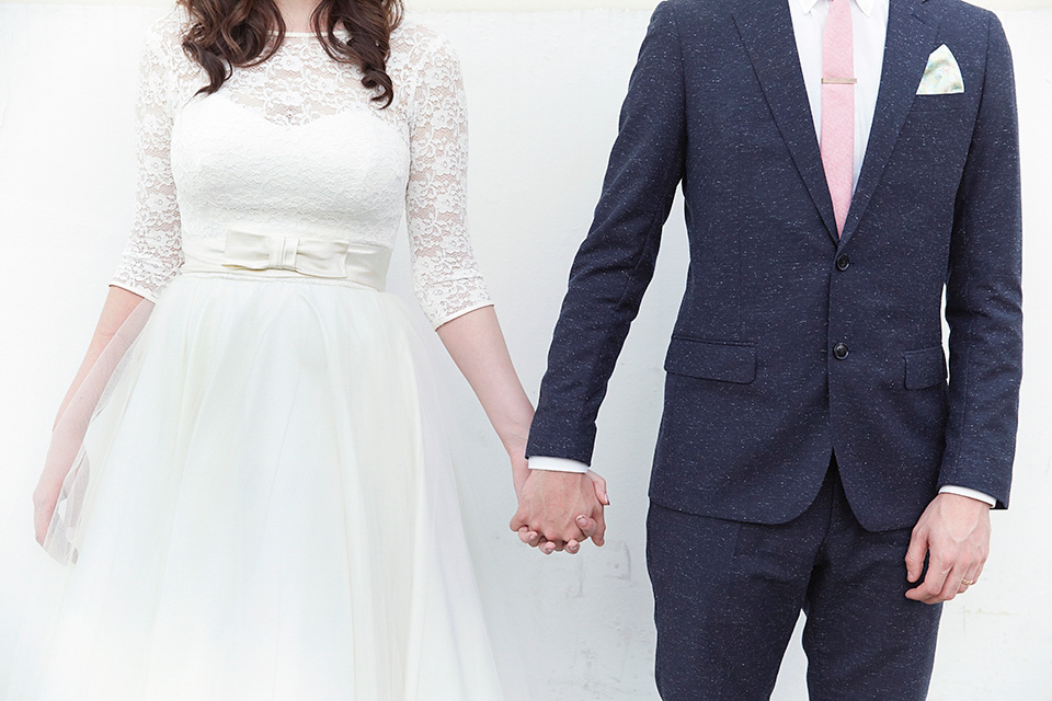 A 50's inspired tea-length dress for a pastel colour London pub wedding. Photography by Natalie J. Weddings.