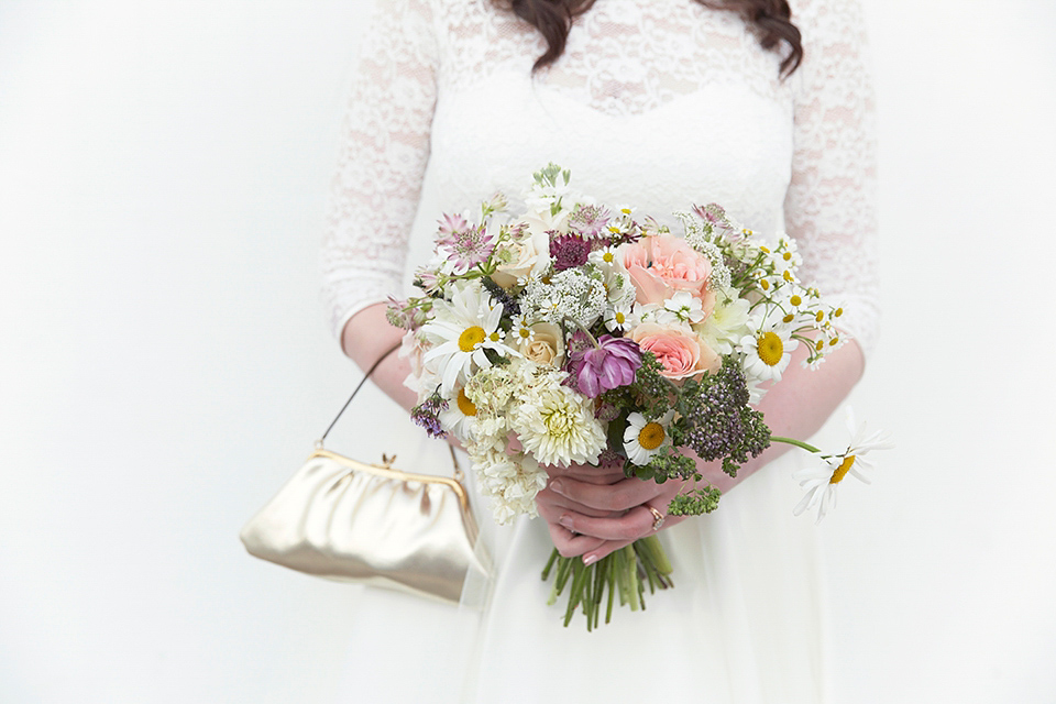 A 50's inspired tea-length dress for a pastel colour London pub wedding. Photography by Natalie J. Weddings.